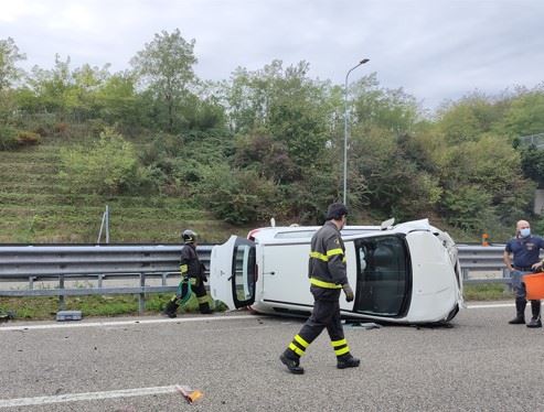 car laying on its side after crash